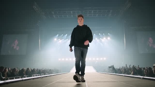 Stage performance render — concert lighting, haze in the beams
